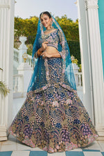 Dazzling Teal Color Net Fabric Wedding Lehenga