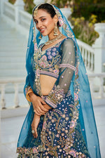 Dazzling Teal Color Net Fabric Wedding Lehenga