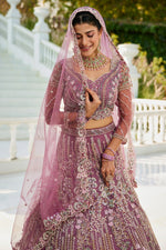 Dazzling Purple Color Net Fabric Wedding Lehenga