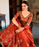 Divine Orange Color Silk Fabric Party Wear Lehenga