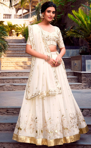 Divine Cream Color Glossy Fabric Party Wear Lehenga