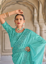 Tasteful Turquoise Color Fancy Fabric Partywear Saree