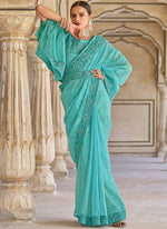 Tasteful Turquoise Color Fancy Fabric Partywear Saree