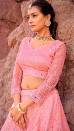 Captivating Pink Color Net Fabric Party Wear Lehenga