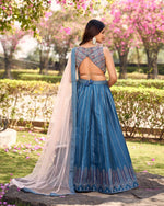 Captivating Turquoise Color Art Silk Fabric Partywear Lehenga